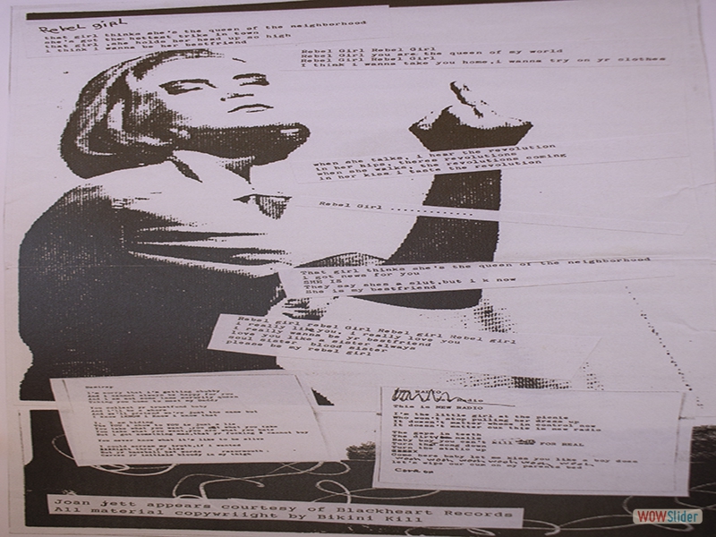 Bikini Kill lyrics written on a typewriter meshed with art. 